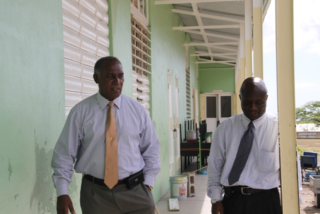 Premier of Nevis and Minister of Education Hon. Vance Amory and Permanent Secretary in the Premier’s Ministry Wakely Daniel visiting the Ivor Walters Primary School at Brown Hill on August 18, 2015, for a first-hand look at ongoing works under the Schools Rehabilitation Project funded by the Nevis Island Administration